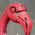 A pink cartoon bird head with a curved beak and closed eye appears in two , one with blue text reading "What It Do Do" and the other with black text reading "The Rabbi!"