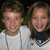 Two people in a photo on the left, blue background with white text reading 'did u k im in luv' and 'with this boy' on right.