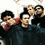 Static 50x50 pixel icon showing four individuals in a group pose with dark clothing and varied hair colors against a light background.