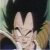 Pixelated static image of a character with spiky dark hair making a hand gesture with two fingers extended, set against a blurred background with green and brown tones.
