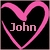 Pixelated pink heart outline with 'John' text inside on black background.