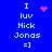 Blue background displays pixelated text "I luv Nick Jonas =]" with pink heart and starburst animations above the text.