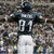 A contact sheet of three animated frames showing a football player in a dark jersey with number 81 and name "WELLS" on the back, viewed from behind against a blurred stadium background.