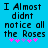 Blue background with black pixelated text reading "I Almost didnt notice all the Roses" and five pink/purple asterisks below.