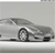 Pixelated grayscale image of a car with visible wheels and headlights on a light background.