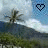 Pixelated landscape with palm tree and mountain under cloudy sky, featuring a heart symbol that changes color across frames.