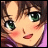 Pixelated anime-style face with brown hair, green eyes, and pink blush, next to stylized text on black background.
