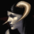 Pixelated profile of a figure with a curved horn-like structure on its head, dark hair, and a light-colored garment against a black background.