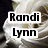 A static image of a white rose with overlaid text elements including 'Randi Lynn', '7194-112907', 'rest in peace', and 'LOVE akron' on black background.