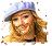 Pixelated image of a person with long brown hair wearing a dark cap and light blue headband, smiling against white background.