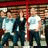 Static 48x48 pixel icon showing three figures in a row with blurred facial features, wearing light and dark clothing against a red-brown background.