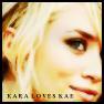 Close-up of a person with light-colored hair and visible eye, mouth, and cheek; text at bottom reads 'KARA LOVES KAI' in block letters.