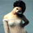 Static pixelated image of a person with dark hair and light skin wearing a white off-shoulder top against a muted blue background.