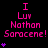 Pixelated text in pink and purple on black background with small purple symbols, repeating 'I Luv Nathan Saracene!' across multiple