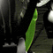 A mechanical figure with green accents and metallic components in a repeating pattern.
