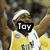 A basketball player in a yellow jersey with white trim and blue accents is shown from the chest up, wearing a headband.