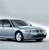 A silver sedan with a dark roof is shown in profile view against a light gray background, positioned slightly left of center.