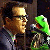 A pixelated image shows a person holding a green puppet with an open mouth, next to text reading 'keep fishin'' in white letters on a dark background.
