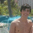 A pixelated image shows a shirtless person standing outdoors near water, with bright pink text reading "The Future Mrs. Jonas" on the right side.