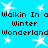 Pixelated text repeats 'Walkin In a Winter Wonderland' on a bright blue background with white star shapes.