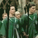 Animated sequence showing Slytherin house crest and Quidditch text over green background with figures in green robes.