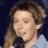 A 48x48 pixel animated contact sheet showing two frames of a Clay Aiken-themed buddy icon with green text on the right and a person holding a microphone on the left.