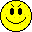 Four pixelated yellow smiley faces in a 2x2 grid, each with distinct facial expressions and features on a gray background.