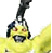 Pixelated yellow figure with dark hair and a black top hat, holding a large curved object against gray background.