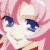 Pixelated close-up of a character's face with pink hair and blue eyes, rendered in low-resolution 256x256 pixels.