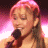 A split-frame contact sheet showing a person with pink hair holding a microphone on the left and green text reading "Original Icons .com" on a dark background on the right.