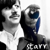 Black-and-white photograph of a person with dark hair and a mustache wearing a light-colored collared shirt, with a blue-tinted object held near their face and 'starr.' text at the bottom.