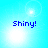 Blue text 'Shiny!' on a light blue background with four distinct bright white circular glows in each quadrant.