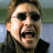 A split-screen image with a pixelated person on the left and green text on the right.