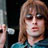 Static 48x48 pixel icon showing a close-up of a person with light brown hair and dark eyes wearing sunglasses, partially visible against a dark background with a blue garment at the bottom.