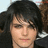 A pixelated image of a person with dark hair against a red background with cyan text reading "We Know That He's PERFECT AND SUPER SEXY!".