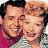 A pixelated buddy icon featuring two smiling cartoon characters with text reading "i love lucy!" on the right side.
