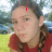 A person in a red sleeveless top with braided hair appears across four , each showing different pixelated text overlays on their face