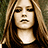 Pixelated image of a person with long brown hair against dark background, accompanied by pixelated text in light blue.