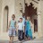 Three figures stand side-by-side in a pixelated image with muted colors and indistinct features.