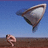 Pixelated static image shows a large fish-like creature with brown and white coloring against blue sky, while a smaller pinkish figure stands on brown ground below.