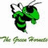 Pixelated green and black character with flowing hair, holding a sword-like object against white background.