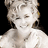 Static 48x48 pixel icon of a person with light-colored hair and closed eyes, wearing a white top against black background.