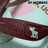A pixelated image shows a dark brown strap with a white buckle, pink fabric, and light blue background on the left; bright pink text 'ZOE E.' appears on the right.