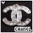 Pixelated silver Chanel logo with black background, pink heart in top-left corner on first frame and white heart on second frame.