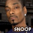 Pixelated static image of a person with short hair wearing an earring and dark clothing, featuring the text "SNOOP" at the bottom in white block letters on a dark background.