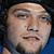 Animated contact sheet of a person's face with changing facial expressions and blue dot animations, each frame displaying the text "Bam" on a dark background.