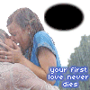 A couple in blue and white clothing kisses on a couch with green foliage background, text "your first love never dies" below.