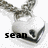 Animated sequence showing a silver bunny pendant with black accents, displaying text that changes from 'sean' to 'is my' then 'key'.