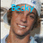 A person wearing a white headband and light blue shirt with text overlays changing across frames.