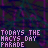 Pixelated text in purple and cyan on a dark background with repeating patterns, featuring phrases about 'TODAYS THE MACYS DAY PARADE' and 'THE MITE OF THE LIVING DEAD IS ON ITS WAY'.